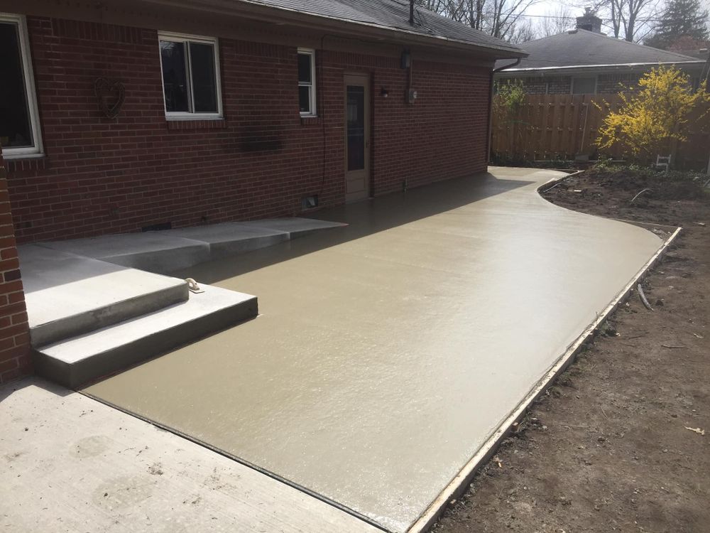 Our Sidewalk Installation service offers homeowners a professional team to pour and finish concrete sidewalks, ensuring durability and aesthetic appeal for safe and beautiful pedestrian pathways around your property. for Paul Turner Concrete & Excavating in Toledo, OH