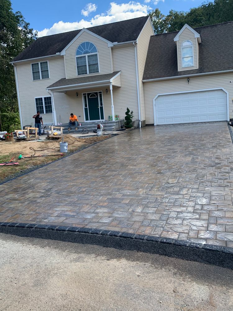 Our Driveway Design & Build service offers homeowners personalized driveway solutions, from design to installation, using high-quality materials and skilled craftsmanship to enhance the aesthetic appeal and functionality of their property. for Elyon Construction and Stoneworks LLC in Windsor, CT