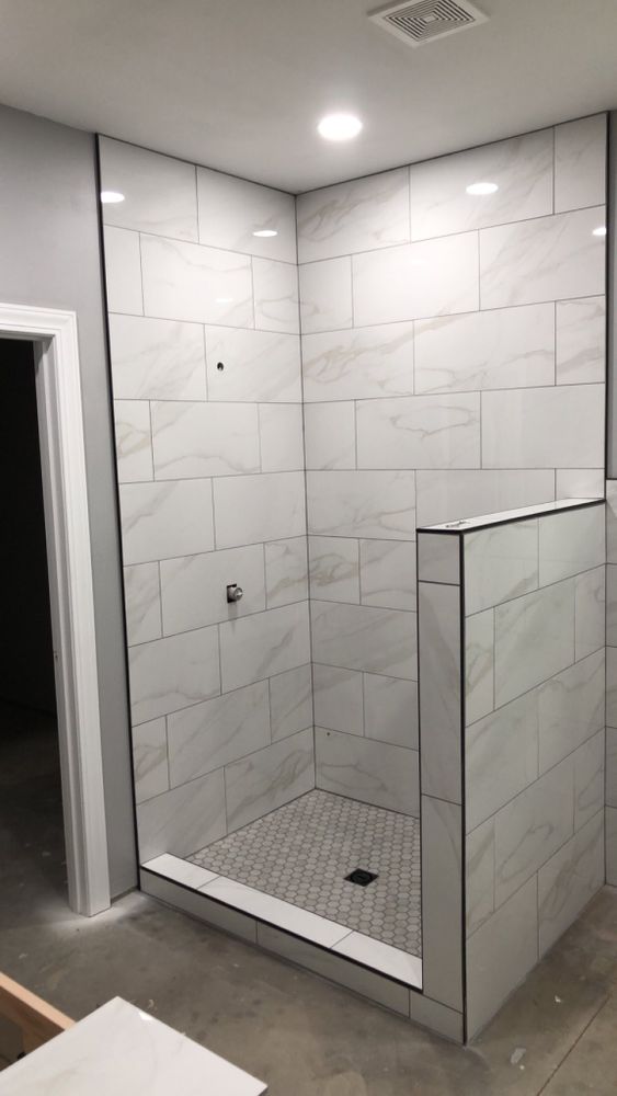 Transform your space with our expert bathroom tiling services. We offer precision, durability, and style to create a beautiful and practical environment that enhances the functionality of your home. for The Tile Guy in Paris, TN
