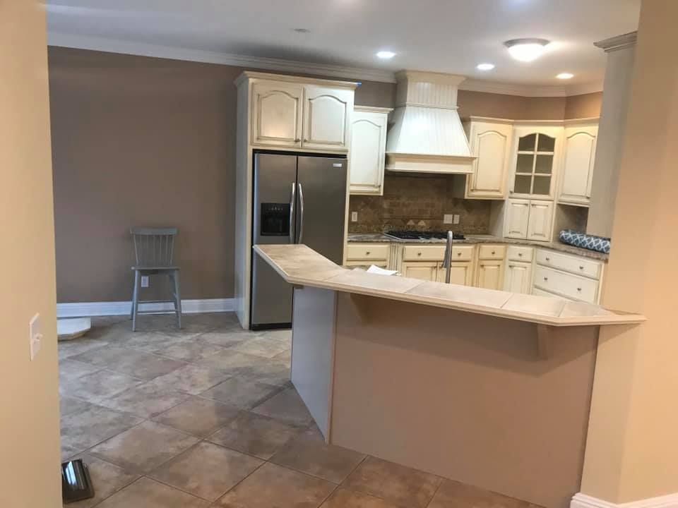 Revitalize your kitchen with our expert cabinet refinishing service. Transform outdated cabinets into a stunning focal point, enhancing the beauty and value of your home with professional painting expertise. for Henry & Son Painting in Hazel, KY