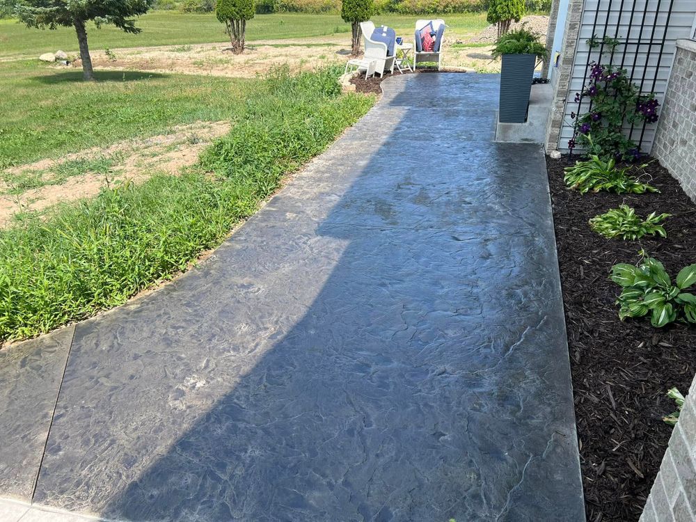 Enhance your home's aesthetic appeal with our stamped concrete installation, offering durable and customizable designs that mimic natural stone, brick, or tile for patios, driveways, walkways – perfect for any outdoor space. for Johnsons Custom Creations in Milaca, MN