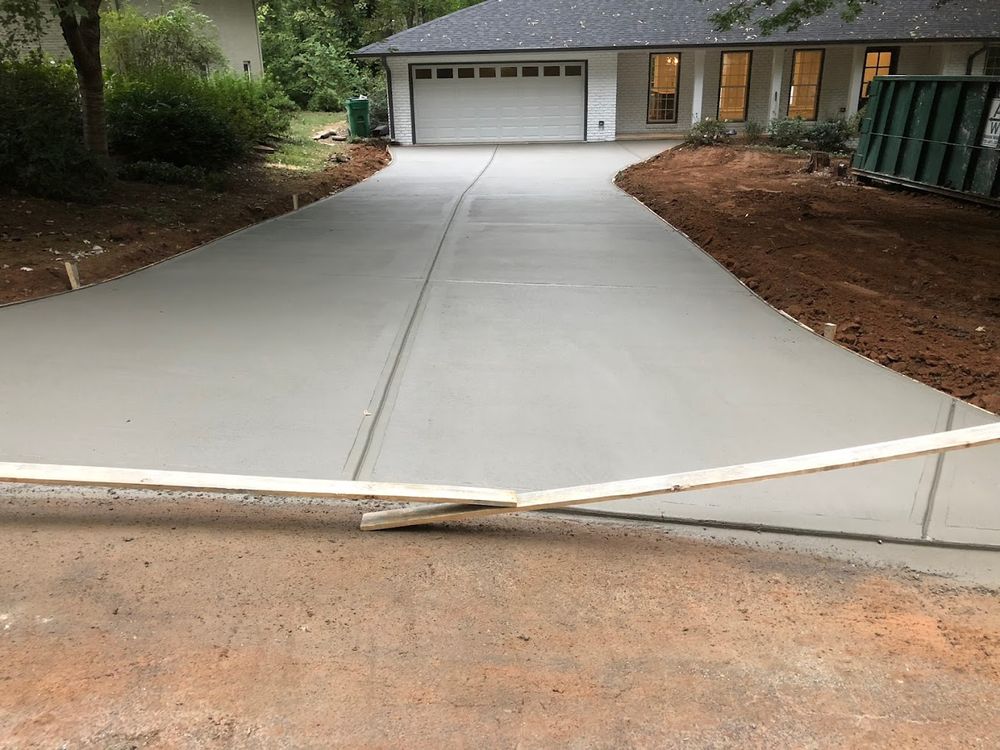 Our Driveway Construction service delivers durable, attractive concrete driveways designed for long-lasting performance, improved curb appeal, and daily use, expertly installed to enhance your home’s value and functionality. for Adams Reconstruction in Clayton, NC
