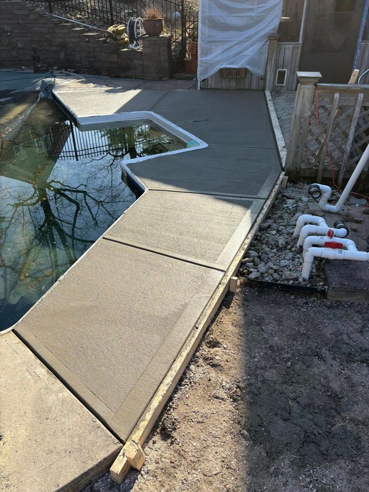 Enhance your property's curb appeal with our professional sidewalk installation service, offering durable and aesthetically pleasing concrete pathways that ensure safety and complement the overall design of your home. for Curtis Concrete Contracting in Trenton, OH