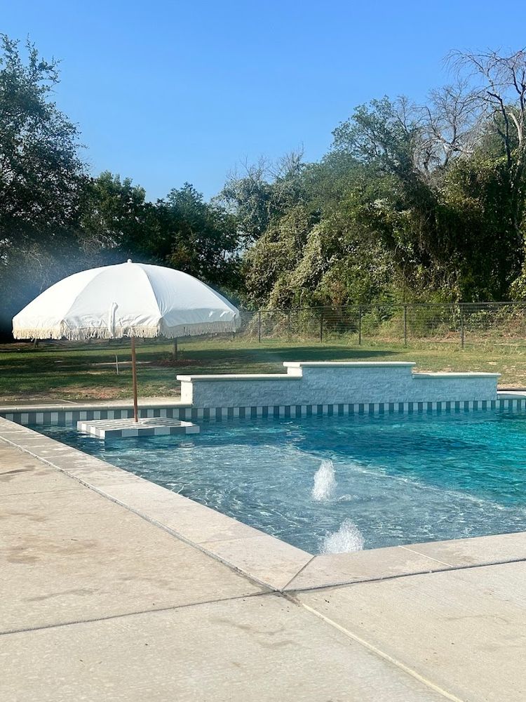 Enhance your pool area with our expertly crafted concrete decks, offering durability, style, and slip-resistant surfaces for safety. Transform your outdoor space into a stunning and functional oasis perfect for relaxation. for Black Diamond Custom Pools LLC in Azle, TX