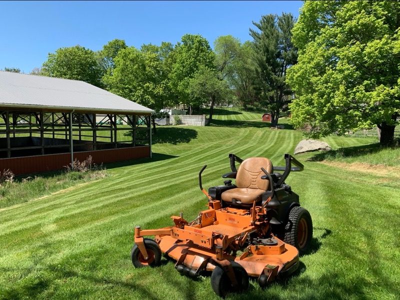 Enhance your lawn's appearance with our expert mowing services. Our precise, efficient care ensures a perfectly manicured yard, promoting healthy growth and enhancing curb appeal for your home's outdoor space. for NK Landscaping LLC in Dutchess County, NY