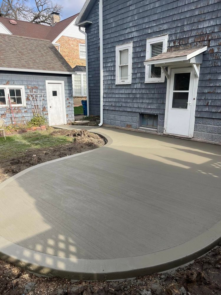 Discover what is concrete flat work with our expert service, offering precision in installing smooth, durable surfaces for patios, driveways, and walkways to enhance your home's beauty and functionality. for PKC Construction in Sterling, IL