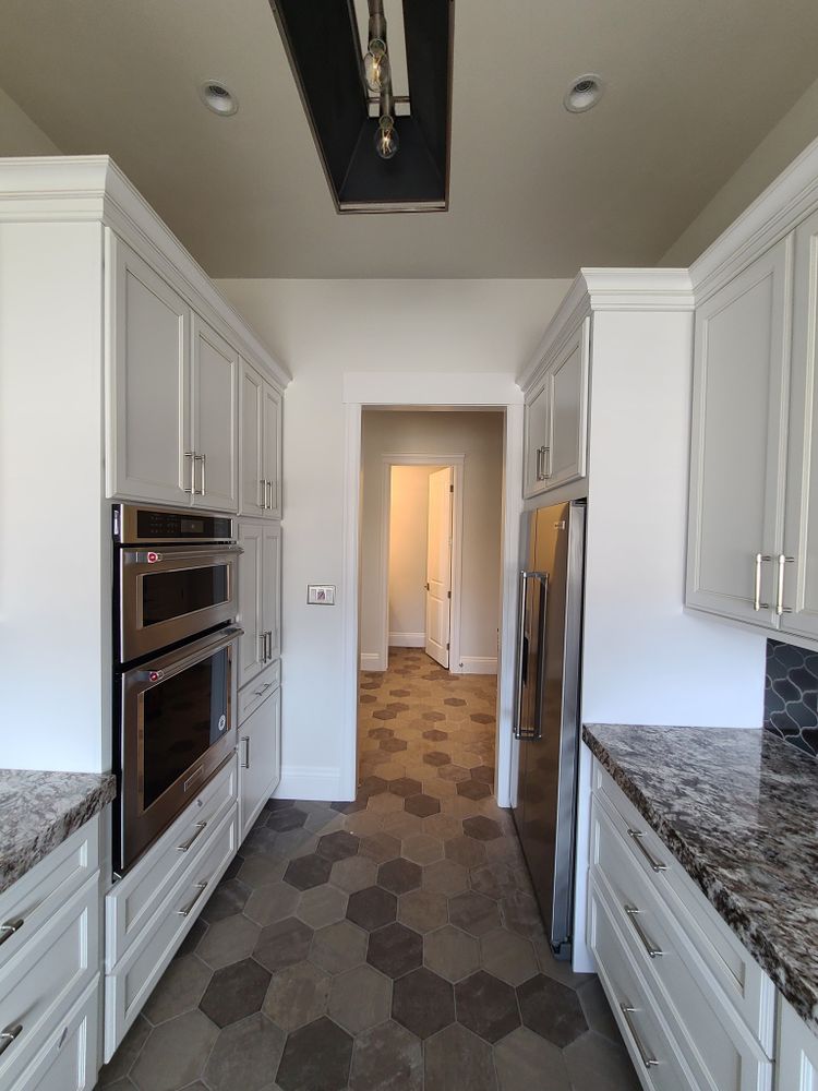 Our Kitchen and Cabinet Refinishing service will renew the look of your cabinets at a fraction of the cost of replacement. We use high-quality paints and finishes to achieve a beautiful, long-lasting finish. for Hoffmann's Custom Painting in Loma, CO