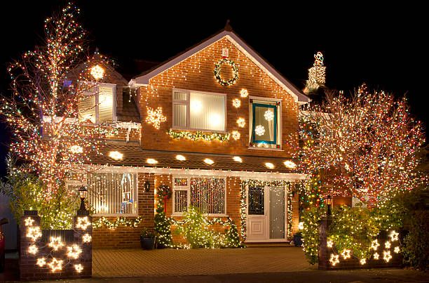 Brighten your home this holiday season with our professional Christmas Light Installation service, offering safe and dazzling displays tailored to enhance your property's unique features. Hassle-free setup and removal included! for King & Sons Urban Forestry in Coeur d'Alene, ID