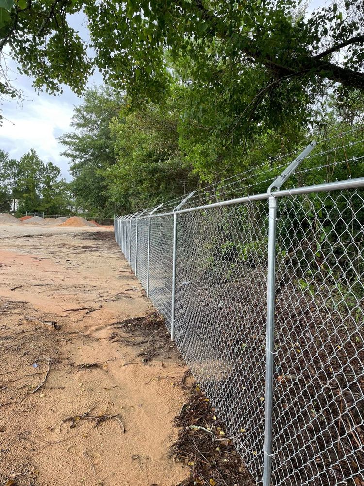 Our professional Fence Installation service offers homeowners top-quality, durable fencing solutions. We ensure precise installation tailored to your property's needs, enhancing security and aesthetic appeal with expert craftsmanship and reliable materials. for Jaguar Fence in Mobile, AL