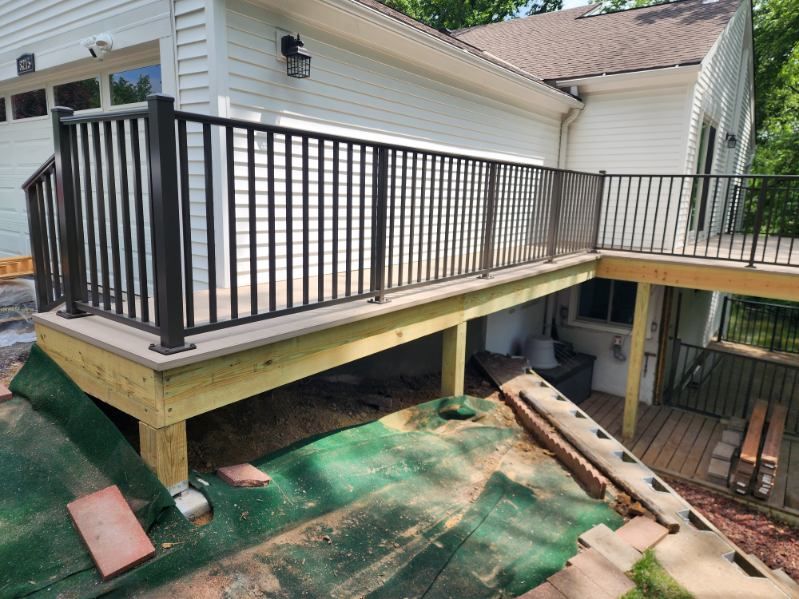 Our Deck & Patio Installation service transforms outdoor spaces with quality craftsmanship and tailored designs, enhancing your home's value and aesthetics while providing a perfect spot for relaxation and entertainment. for SKL Construction in Independence, MO