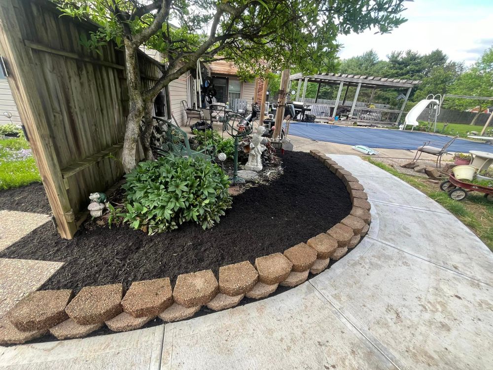 Enhance your garden's aesthetic appeal with our Mulch Installation service. Our team will expertly spread mulch to suppress weeds, retain moisture, and improve soil health for a vibrant landscape. for OneCallCuts in Middletown, OH