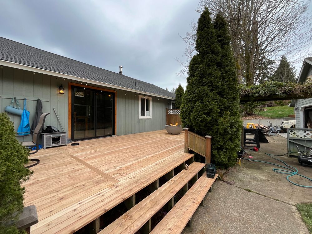 Transform your outdoor space with our expert Decks & Patios service, offering custom designs, quality craftsmanship, and durable materials to create a beautiful and functional area for relaxation and entertainment. for Pacific Roots Construction in Silverdale, WA