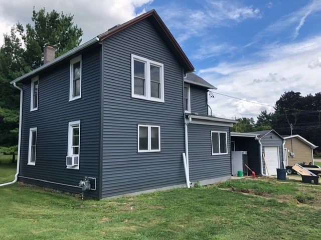 Enhance your home's curb appeal and energy efficiency with our expert vinyl siding house services, offering durable and stylish solutions tailored to fit any aesthetic while providing lasting protection against the elements. for C.P. Construction in Argyle, WI