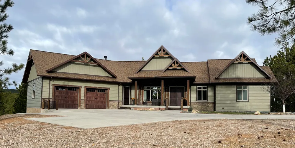 Our Custom Home Design service offers homeowners the opportunity to create a personalized dream home with unique features, layouts, and finishes tailored to their specific needs and style preferences. for Horstmann Homes in Blackhills, SD