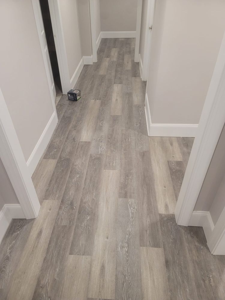 Our Luxury Vinyl Plank (LVP) service offers homeowners a durable and stylish flooring option that replicates the look of hardwood or stone at a fraction of the cost. for Go With The Grain Flooring LLC  in Walton ,  GA
