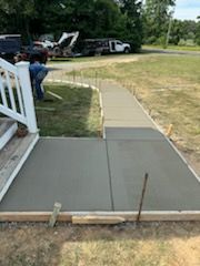 Enhance your home's curb appeal and functionality with our professional Sidewalk Installation service. Our experienced team will expertly install durable and visually appealing sidewalks to improve your property. for Self Concrete Inc in Heathsville, VA