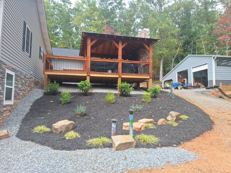 Enhance your outdoor space with our specialized landscaping services, designed to complement our expert carpentry work. Transform your yard into a beautiful and functional extension of your home. for Blue Collar Construction in Blue Ridge, GA