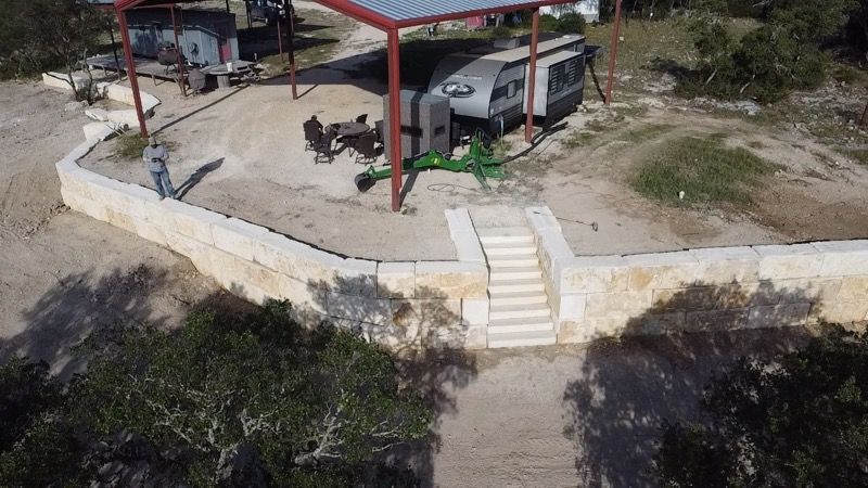 Limestone blocks retaining wall  for De Leon Carpentry & Renovation  in Leakey, TX