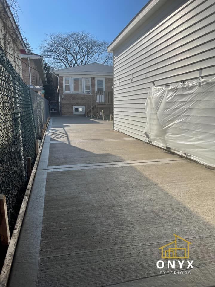 Transform your outdoor space with our Sidewalk Installation service. Our expert team will install durable and visually appealing sidewalks, enhancing the beauty and functionality of your home's exterior. for Onyx Concrete Contractors in Chicago, IL