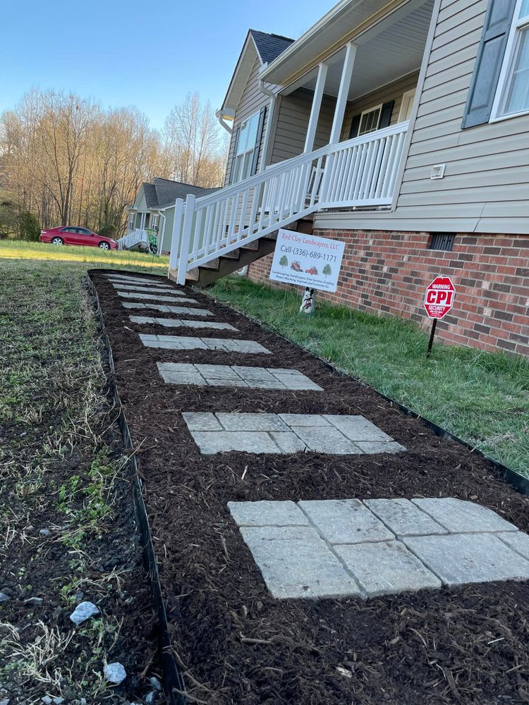 Upgrade your outdoor space with our expert retaining wall construction service. Improve the functionality and aesthetics of your property, creating a durable and visually pleasing landscaping solution for added value. for Red Clay Landscapers in Sophia, NC