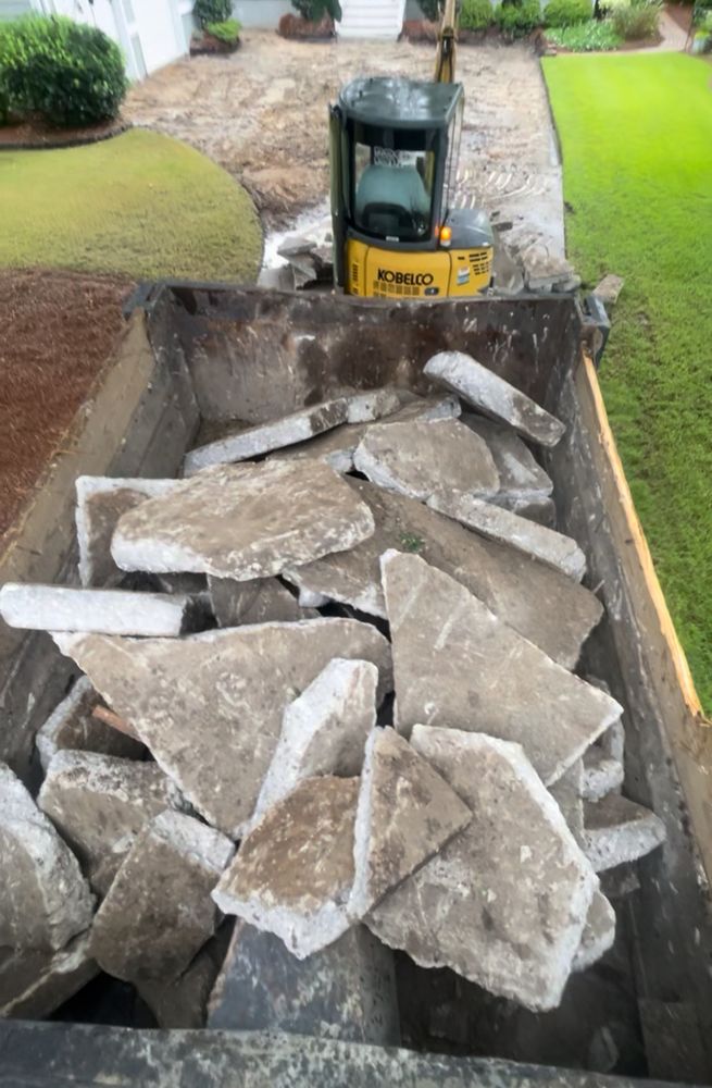 Our concrete services specialize in efficiently tearing out and hauling off old concrete, ensuring a clean and prepared site for your next project. Perfect for homeowners looking to upgrade their spaces. for Rock Solid Custom Concrete in Wilmington, NC