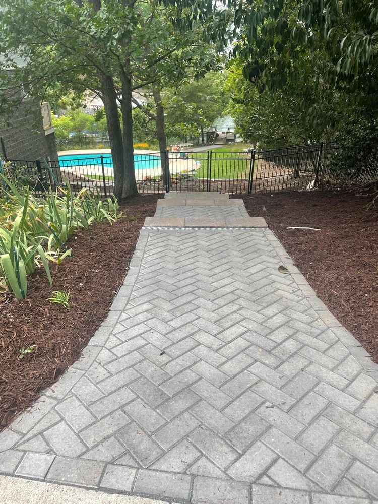 Transform your outdoor space with our professional paver walkway installation service. Enhance curb appeal while enjoying the convenience of local expertise, just like our "Christmas lights installation near me" option offers. for J’s Developers LLC Welding and Landscaping in Charlotte, NC