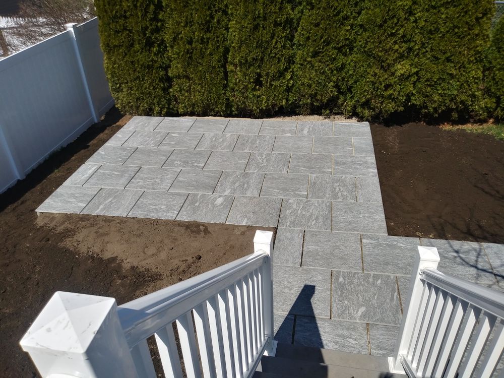 Our Hardscaping service transforms your outdoor space with expertly crafted features like patios, retaining walls, and walkways to enhance the beauty and functionality of your property. for Roeger Property Solutions in Haverhill, MA