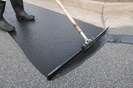 Enhance your driveway's durability and appearance with our professional seal coating service, protecting against weather deterioration and extending the lifespan of your asphalt for long-lasting beauty and functionality. for Custom Paving in Savannah, GA