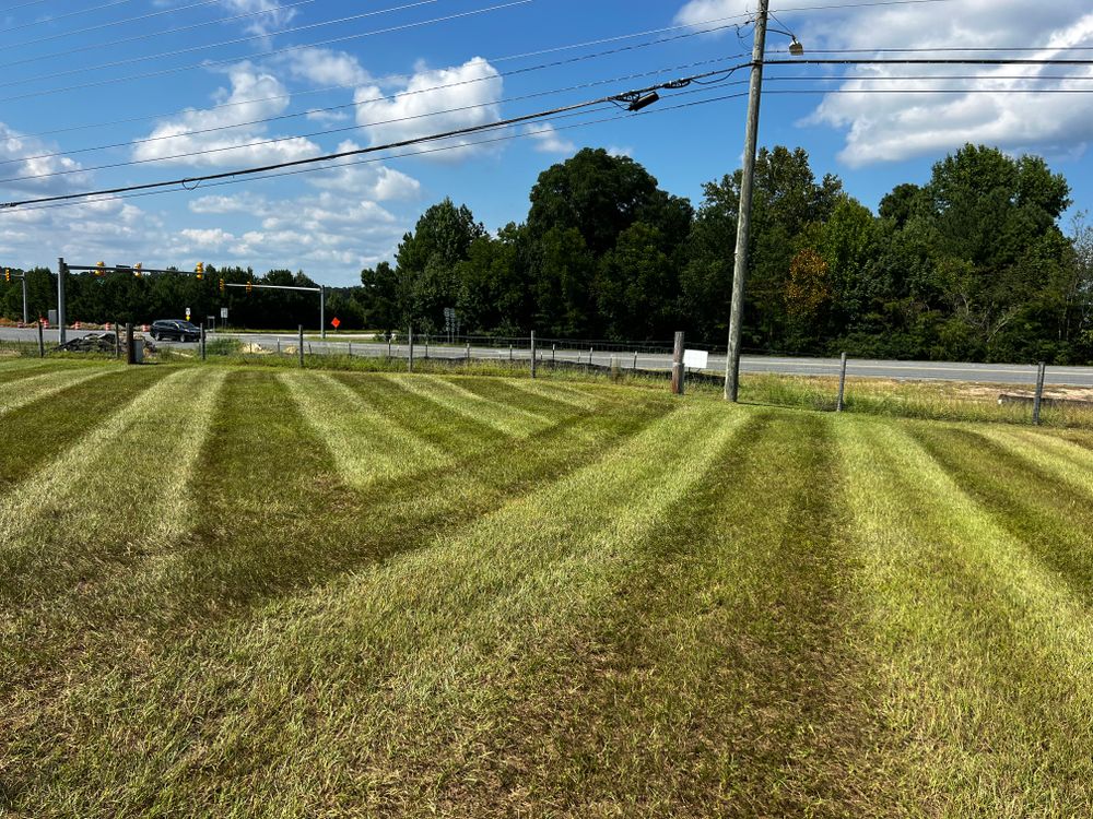 Our Lawn Maintenance service includes mowing, edging, trimming, and debris removal to ensure your lawn stays healthy and beautiful year-round. Let us take care of your outdoor space. for KM Landworks in Moncure ,  NC