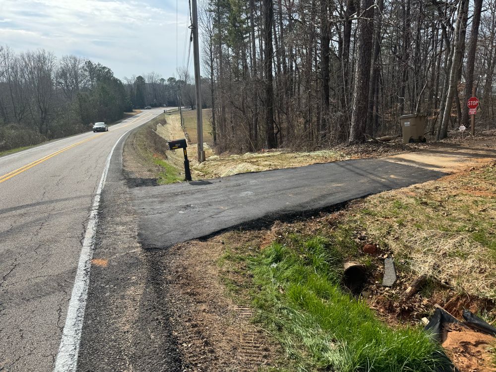 A service we also offer is asphalt repair such as filling pot holes and add ons to preexisting roads such as turn arounds for Under Grace Transport and Grading in Marble Hill, GA