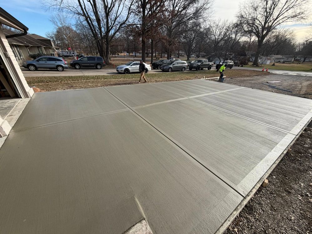 Transform your home's exterior with our expert driveway construction services. We specialize in durable and aesthetically pleasing concrete slab construction, ensuring a long-lasting addition that enhances curb appeal and functionality. for Hyatt Constructions in Buckner, MO