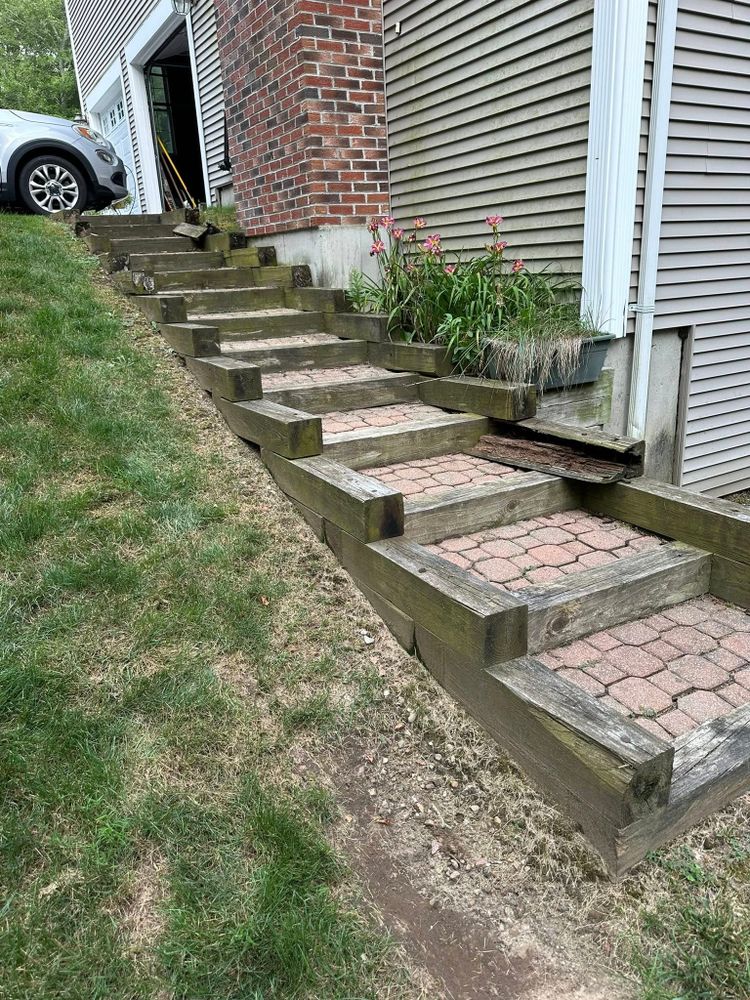 Our retaining wall construction service enhances your landscape's beauty and functionality, preventing soil erosion while adding a visually appealing structure that complements your outdoor living space perfectly. for Shawn's Landscaping in Mendon, MA