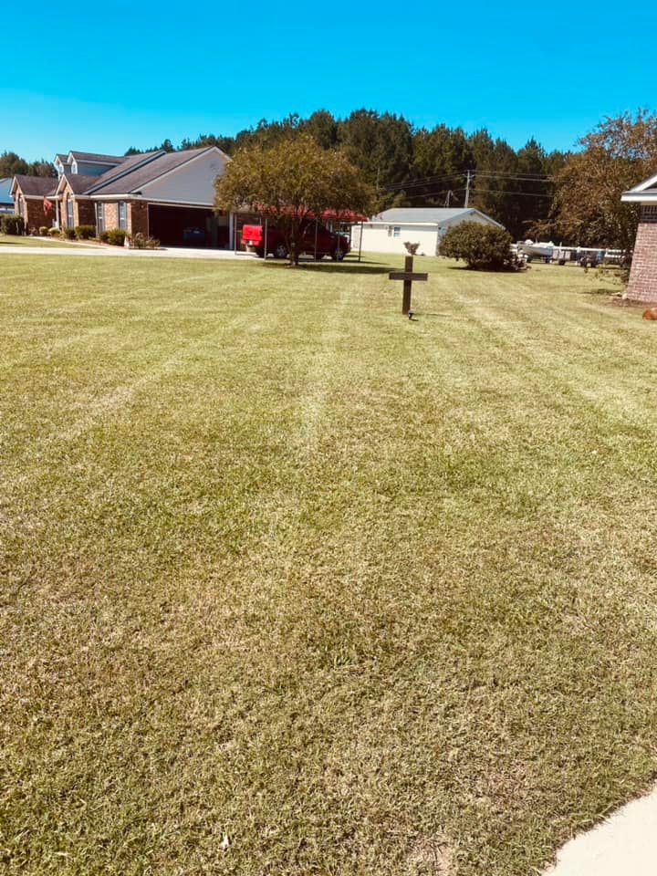 Our Lawn Maintenance service ensures a lush, healthy lawn with regular mowing, fertilization, and weed control. Enjoy a beautifully manicured yard without the hassle, enhancing your home's curb appeal effortlessly. for T&S Land Management Services in Springfield, GA