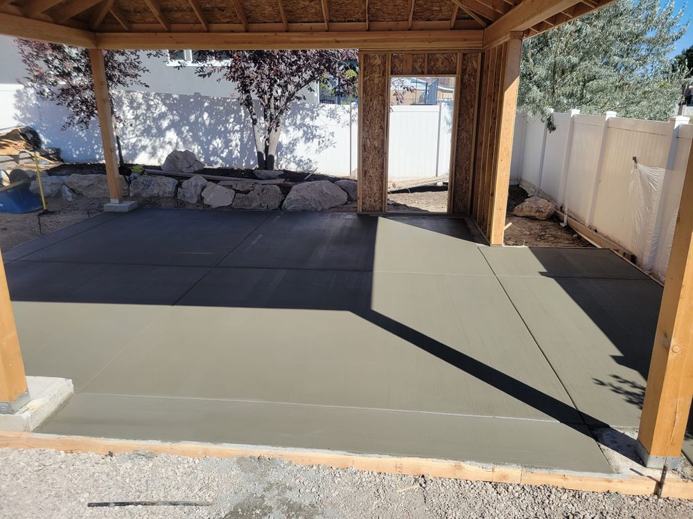 Transform your outdoor space with our expert Patio Design & Installation service, offering customized concrete solutions that blend aesthetics and durability to create the perfect setting for relaxation and entertainment. for Artisan Concrete in Bluffdale, UT