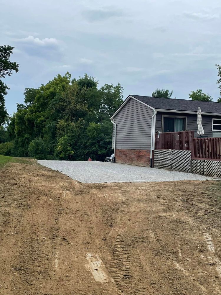 Our Excavating Company offers expert gravel driveway maintenance, ensuring durability and aesthetic appeal. We provide thorough grading, filling, and compaction services for a smooth, long-lasting surface that enhances your home's curb appeal. for Procraft Excavation Services in New Richmond, OH