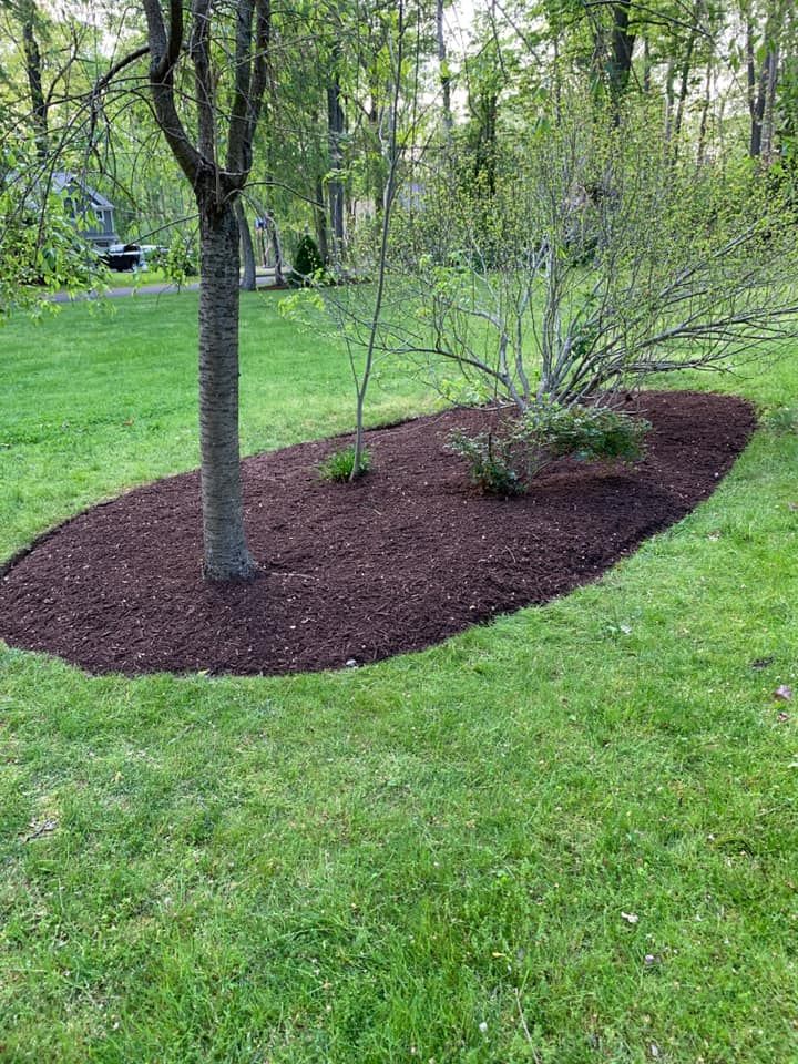 Our Mulch Installation service enhances your landscaping by adding a layer of mulch that improves soil quality, retains moisture, suppresses weeds, and gives a polished look to your outdoor space. for Adens Lawn Maintenance LLC  in Old Lyme, CT