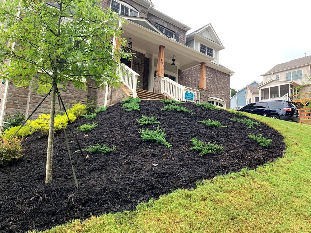 Enhance your lawn's health and appearance with our Mulch Installation service. Our team will carefully apply mulch to your landscape to retain moisture, suppress weeds, and promote plant growth. for Arciniega Landscapes in Acworth, Georgia