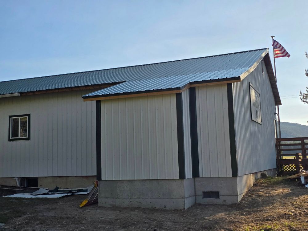 Our metal roofing service offers homeowners durable, energy-efficient solutions designed for long-lasting protection and minimal maintenance, enhancing your home's aesthetic appeal while providing superior weather resistance. for Cabinet Mountain Carpentry in Sanders County, MT