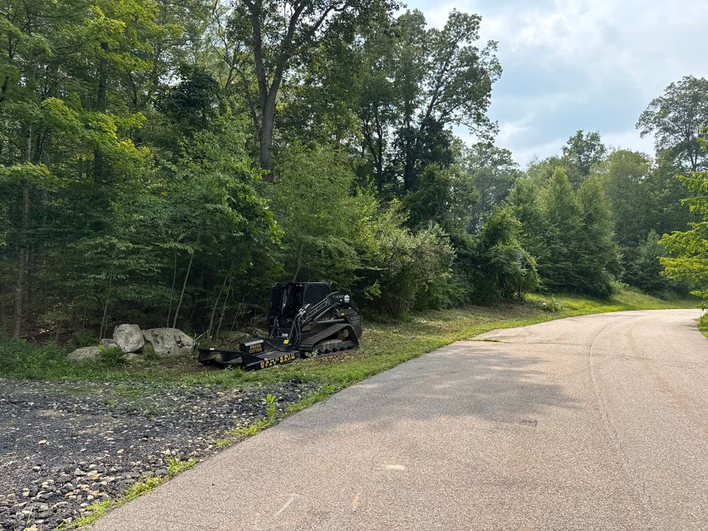 Our Forestry Mulching service efficiently clears land by grinding vegetation into mulch, enhancing soil health and preparing your property for future projects while maintaining eco-friendly practices. Perfect for homeowners seeking sustainable land management solutions. for Triple C’s Excavation in Ashford, CT