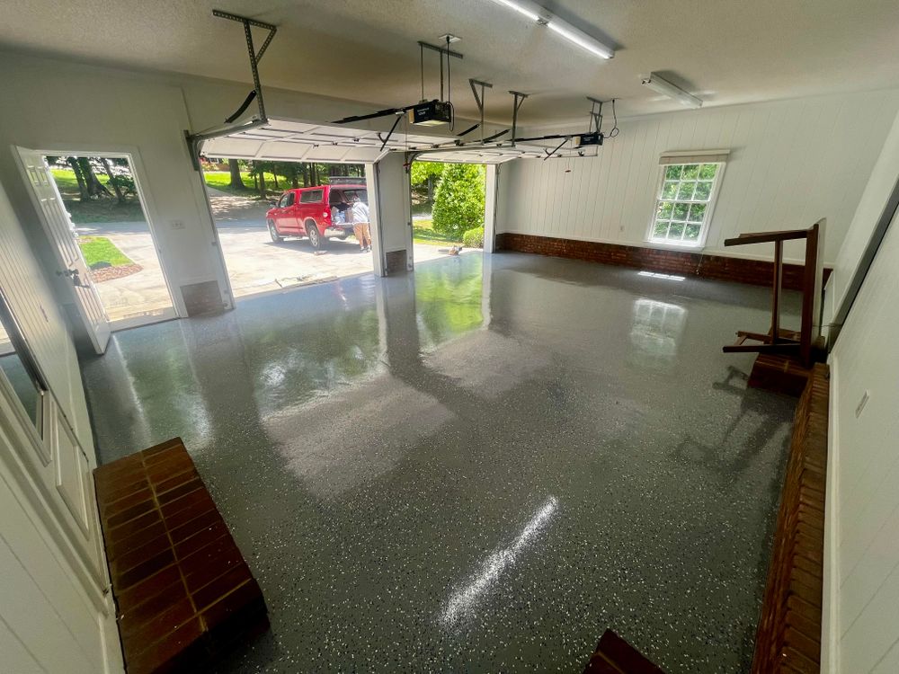 Transform your garage floors with our durable and stunning epoxy floor finishes, providing a seamless, easy-to-clean surface that enhances aesthetics while offering long-lasting protection. for Y&S Painting in Asheville, NC