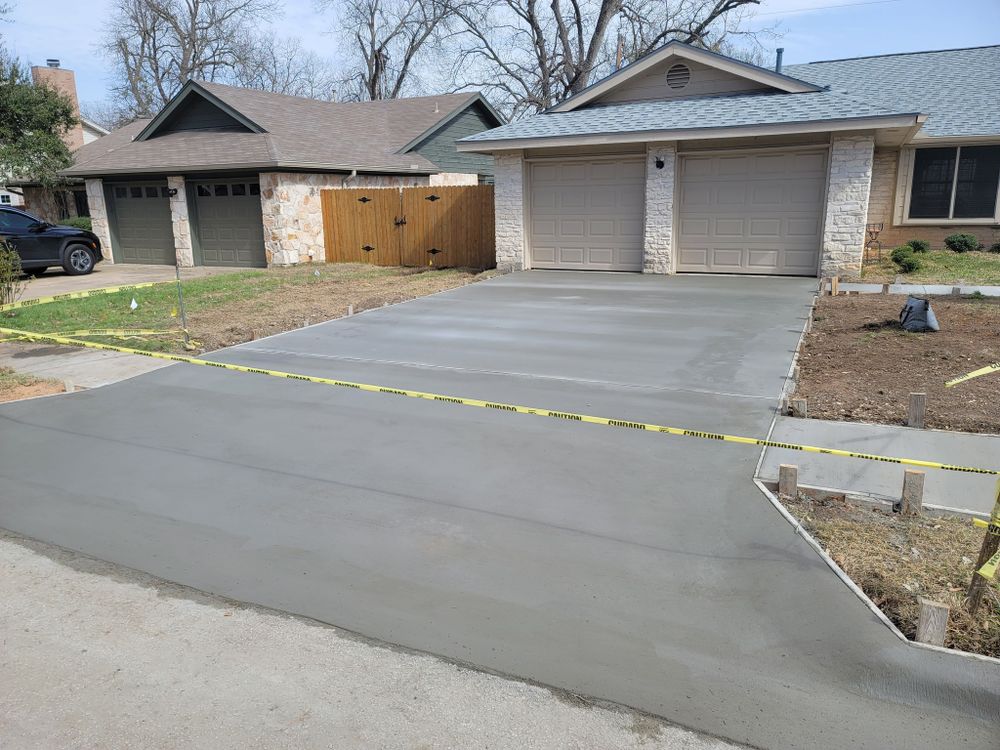 Enhance your home's curb appeal with our professional driveway construction service, offering durable and aesthetically pleasing concrete solutions tailored to fit your specific needs and complement your property perfectly. for Affordable Concrete Specialist in Round Rock, TX