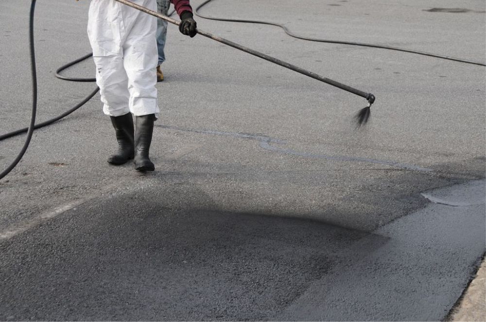 Enhance your driveway's longevity and appearance with our professional seal coating service, providing a protective layer against weather, UV rays, and wear while maintaining the rich black finish of fresh asphalt. for Under Pressure Seal Coating and Lot Striping in Colquitt County, GA