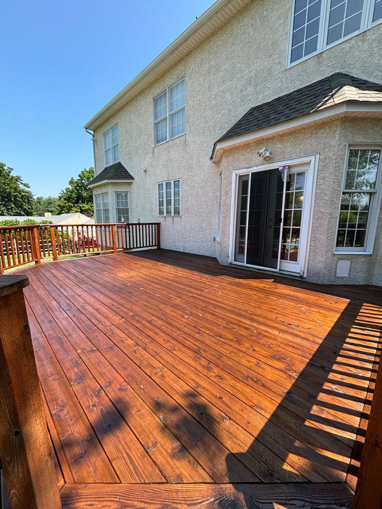 Enhance your outdoor spaces with our deck staining service. Combine expert stain application with thorough deck & patio cleaning to protect and revitalize the beauty of your wooden surfaces. for Creekside Power Washing & Painting in Aston Township, PA