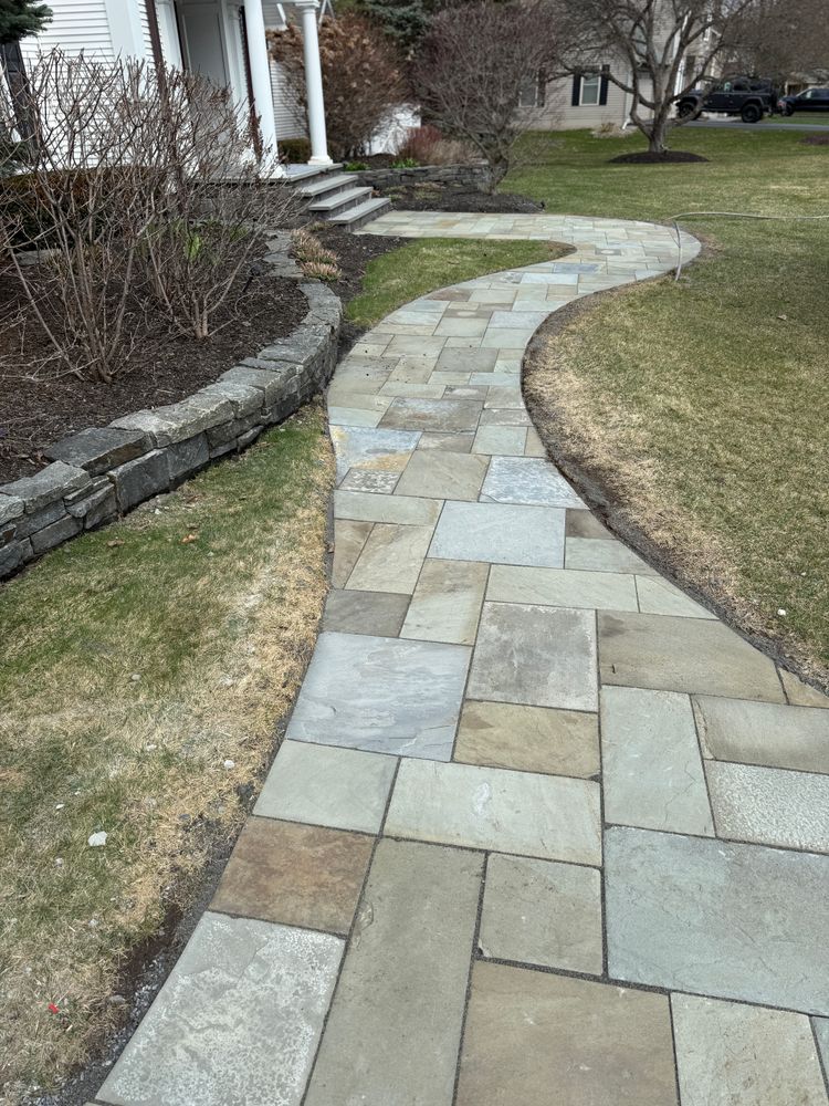 Our Bluestone service designs and installs durable, elegant patios, walkways, steps, and outdoor features using premium stone, creating timeless beauty, lasting value, and functional spaces that enhance your home. for The Lawn Guy Landscape & Hardscape Solutions in Saratoga Springs, NY