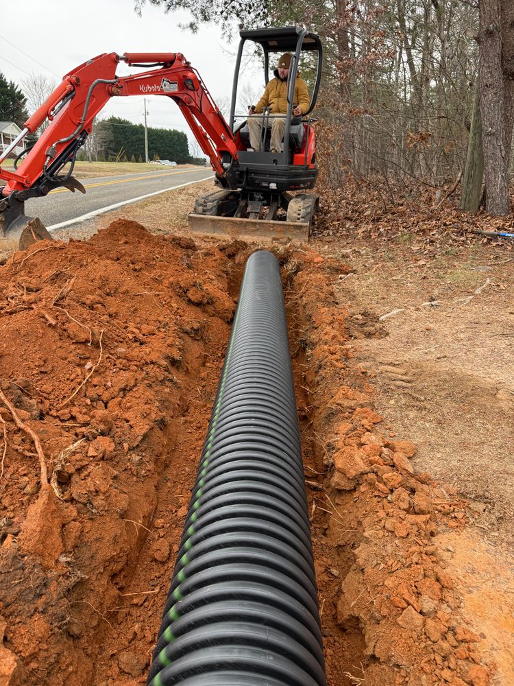 Ensure your property remains pristine with our expert water drainage solutions. We install drainage systems to prevent water buildup, protecting your landscape and hardscape from damage while enhancing overall functionality. for Quartz Creek in Claremont, NC