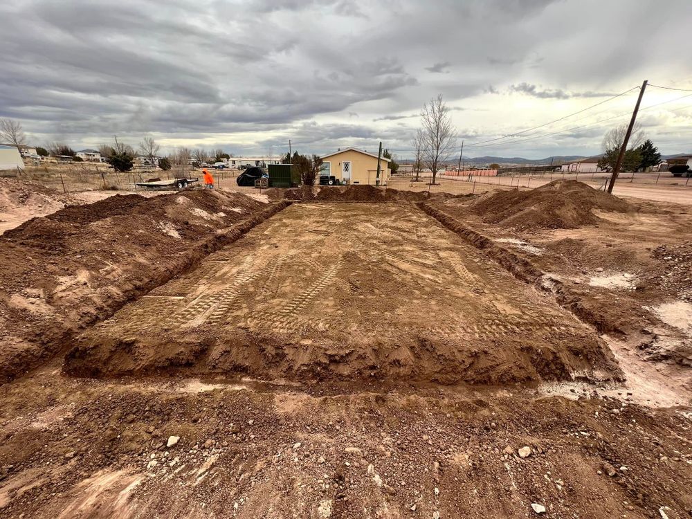 Enhance your property's landscape with our expert land grading service, ensuring a level foundation and effective drainage, ultimately preparing the site for flawless concrete installations and boosting overall home stability. for OSC Contracting LLC in Prescott, AZ