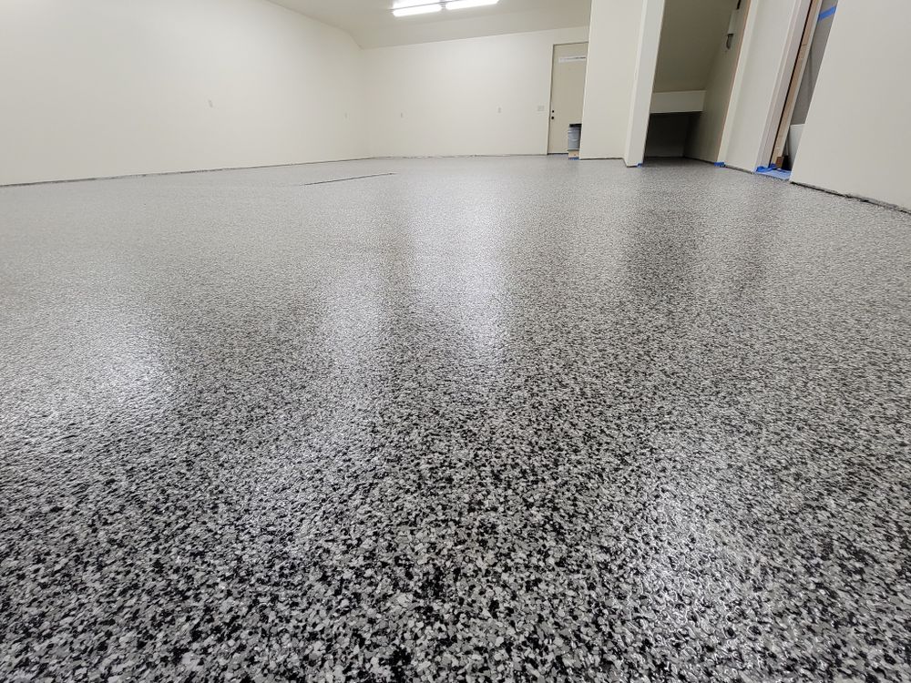 Transform your floors with our durable epoxy coating service, offering a seamless, glossy finish that resists stains and abrasions, enhancing both the beauty and longevity of your concrete surfaces. for Majestic Concrete and Landscape in Cross Lake, MN
