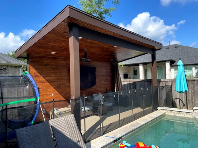 Enhance your outdoor living space with our custom patio covers, offering stylish protection from the elements. Enjoy durable materials and expert craftsmanship tailored to complement your pool area perfectly. for Out Back Pool and Spa Creations in The Woodlands, TX