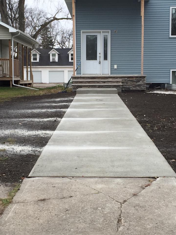 Transform your outdoor space with our Sidewalk Installation service. Our experienced team will create a durable and visually appealing sidewalk that enhances the beauty and functionality of your home. for J Gomez Construction LLC in  Grand Forks, ND