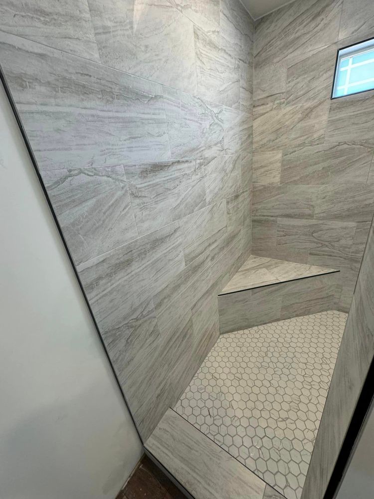 Upgrade your bathroom with our professional tiling service. Our experienced team will expertly install high-quality tiles to transform your space, creating a stunning and durable finish for your home. for McCollum Tile in Hartwell, GA